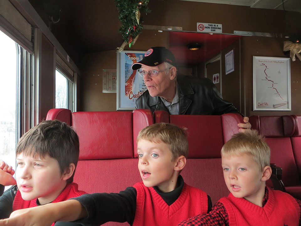 Grandpa wearing his train hat with grandsons! - by Ann Baptist