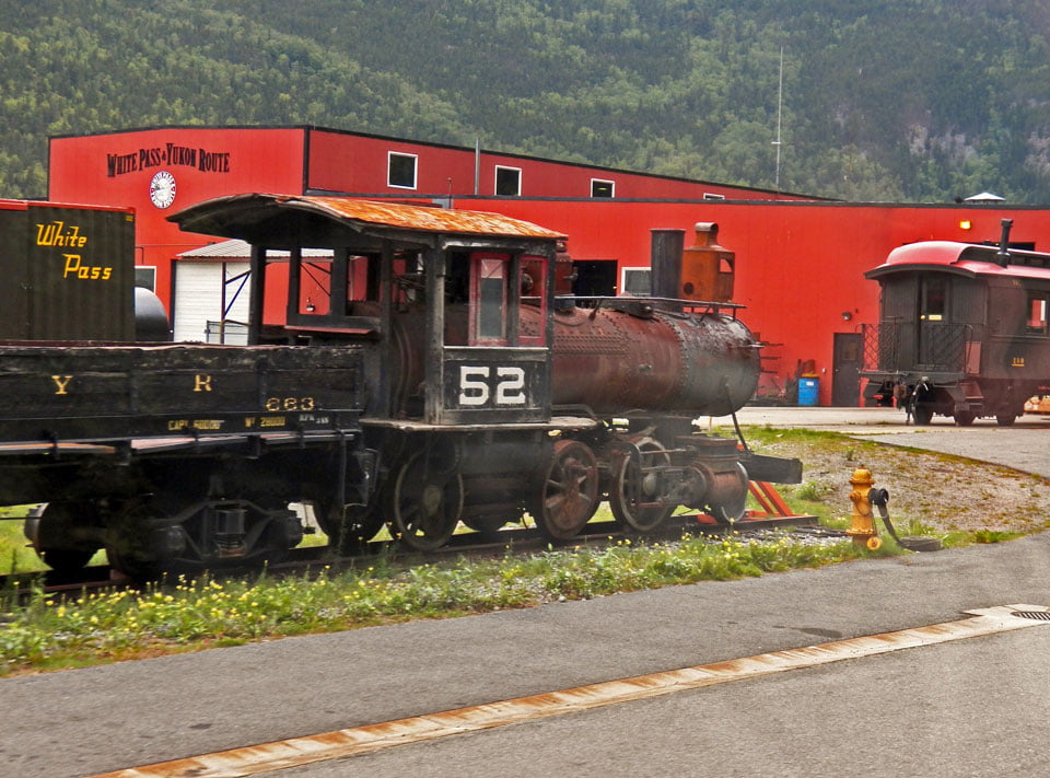 The iconic engine commands attention at the WP&Y RR yard in Skagway - by Peter T. Rossi