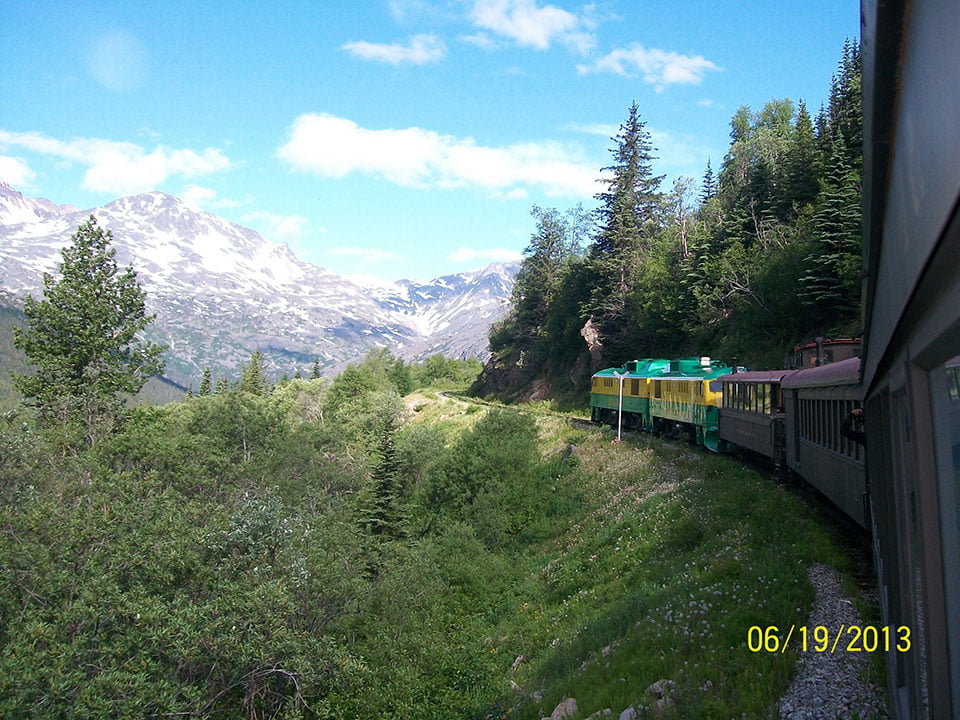 The train looking back down to Skagway on it's climb to the top. - by Luke Marsiglia