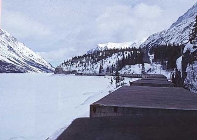 Northbound train at Guard Rail Curve, Lake Bennett. Location:MP 43. Milepost:Mile 43.6. Date:1980-03-00